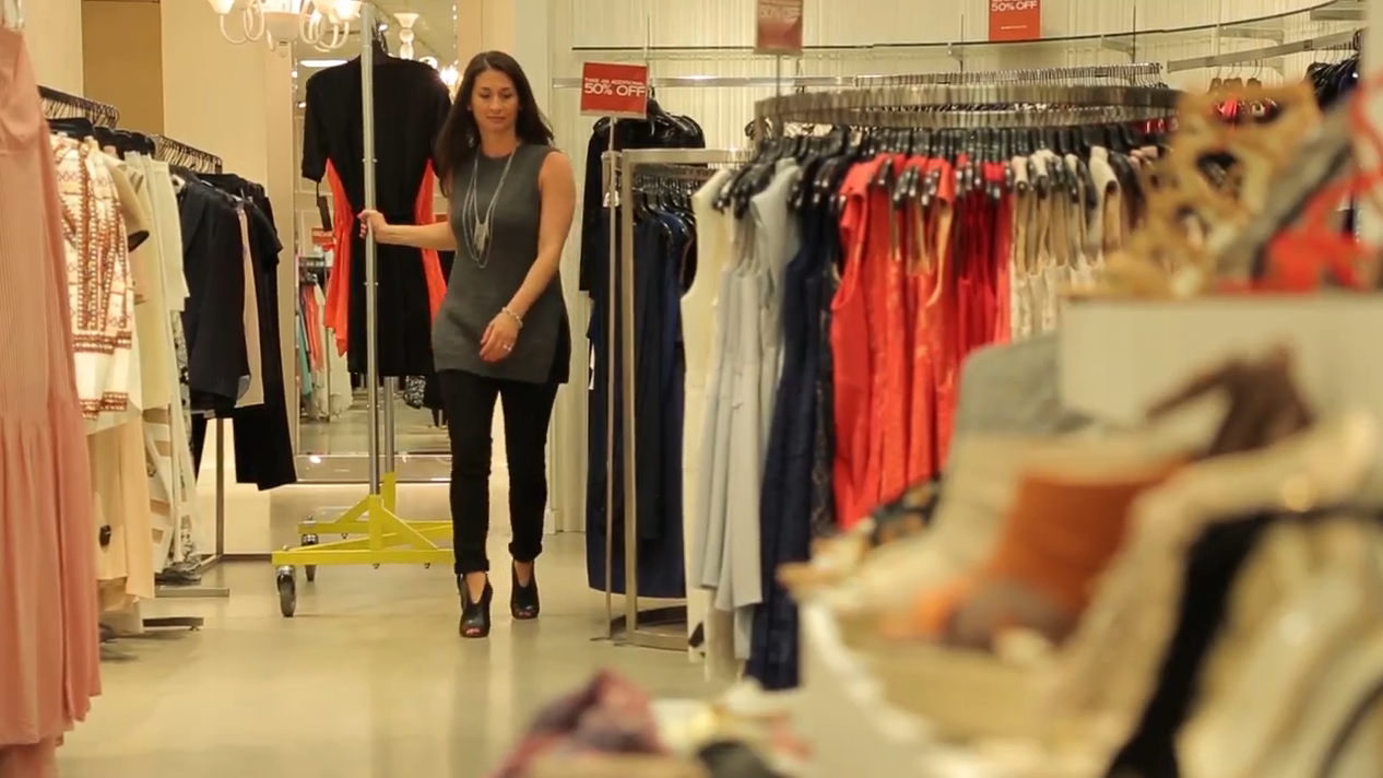 women walking in store with mobile rack